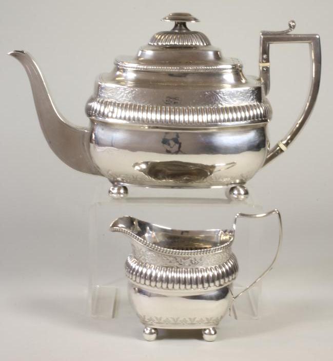 *A LATE GEORGE III SILVER TEAPOT Image