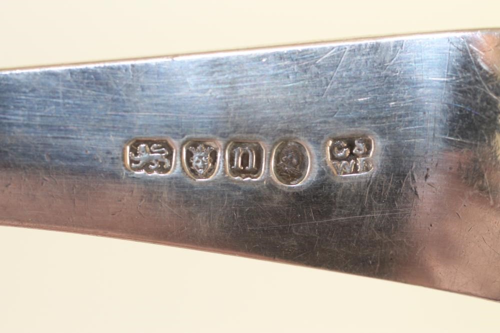 A GEORGE III SILVER SOUP LADLE Image