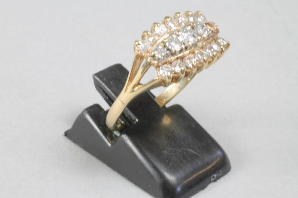 A DIAMOND DRESS RING centred by four (settings for five) graduated brilliant cut diamonds within Image