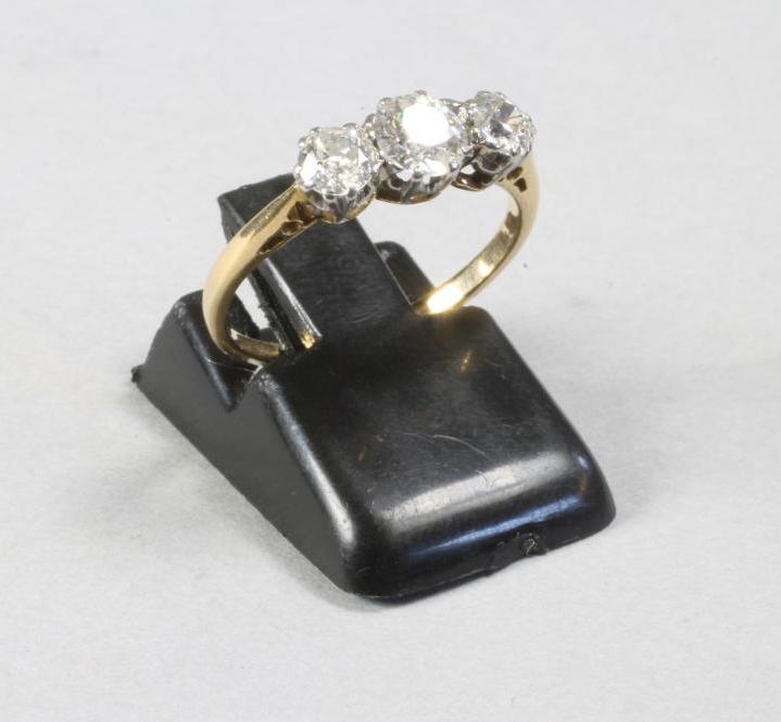 A THREE STONE DIAMOND RING Image
