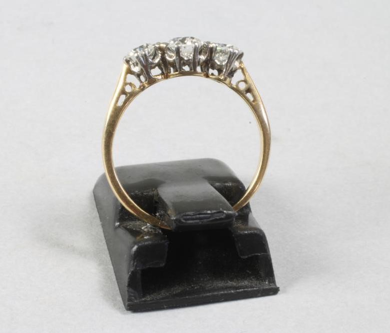 A THREE STONE DIAMOND RING Image