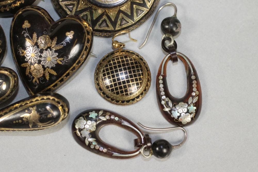 A COLLECTION OF VICTORIAN TORTOISESHELL PIQUE WORK JEWELLERY comprising six brooches and three pairs Image