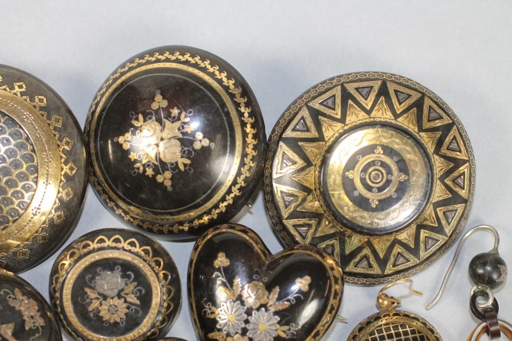 A COLLECTION OF VICTORIAN TORTOISESHELL PIQUE WORK JEWELLERY comprising six brooches and three pairs Image