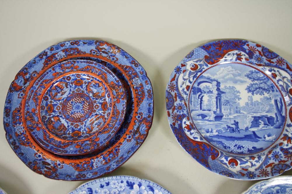 A COLLECTION OF TWELVE SPODE BLUE AND WHITE PRINTED EARTHENWARE PLATES Image