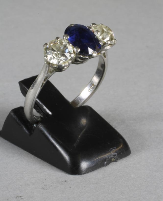 A SAPPHIRE AND DIAMOND THREE STONE RING Image