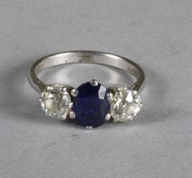 A SAPPHIRE AND DIAMOND THREE STONE RING Image