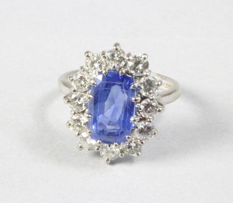 A SAPPHIRE AND DIAMOND CLUSTER RING Image