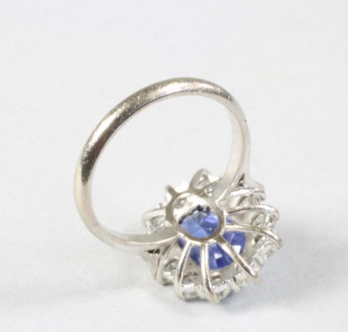 A SAPPHIRE AND DIAMOND CLUSTER RING Image