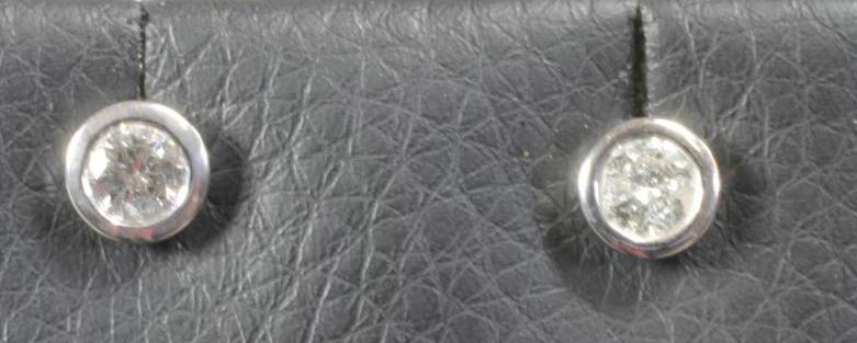 A PAIR OF DIAMOND EAR STUDS Image