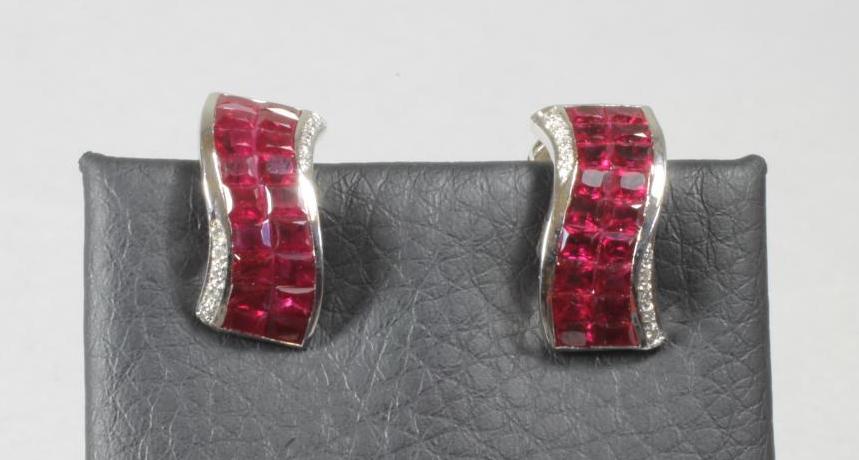 A PAIR OF RUBY AND DIAMOND EAR STUDS Image