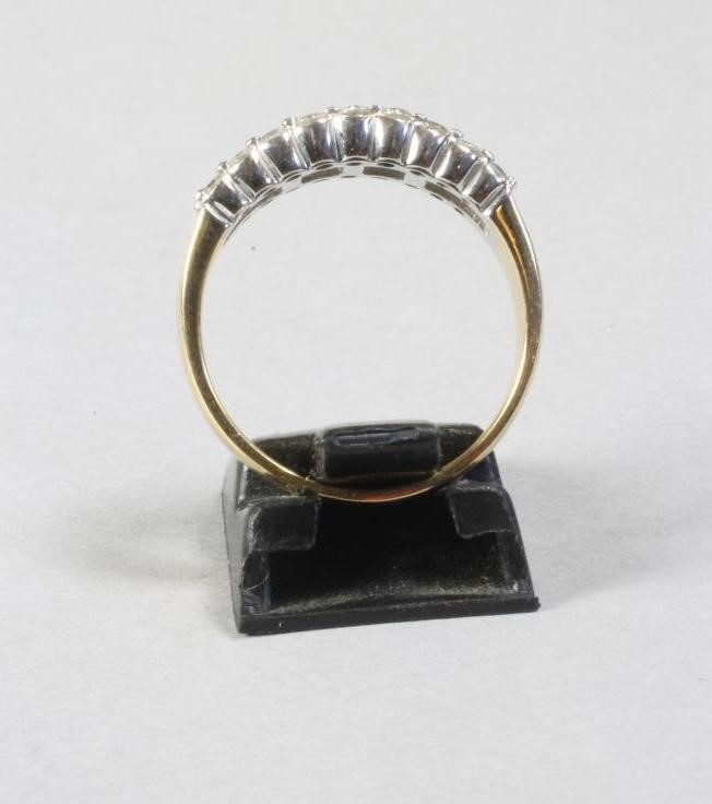 A DIAMOND HALF HOOP ETERNITY RING Image