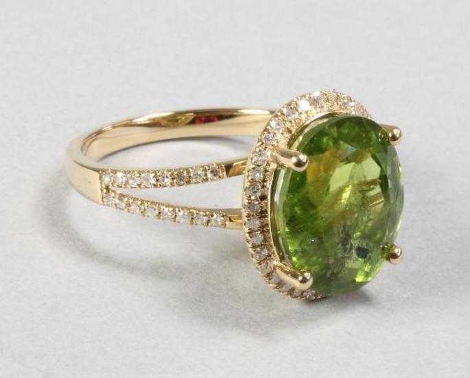 A PERIDOT AND DIAMOND DRESS RING Image