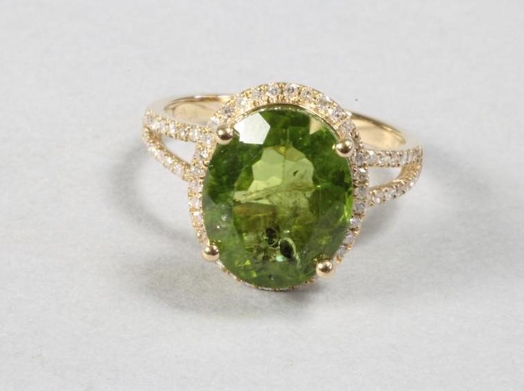 A PERIDOT AND DIAMOND DRESS RING Image