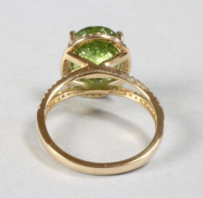 A PERIDOT AND DIAMOND DRESS RING Image
