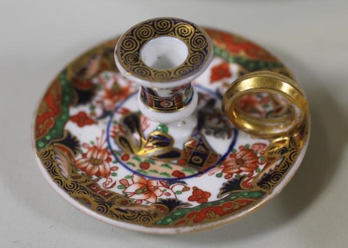 A COLLECTION OF FIVE REGENCY AND LATER PORCELAIN CHAMBERSTICKS Image