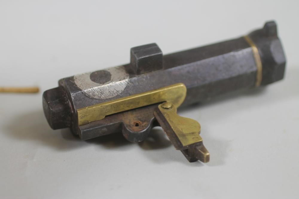 A LATE EDO PERIOD NETSUKI TEPPO MATCHLOCK PISTOL Image