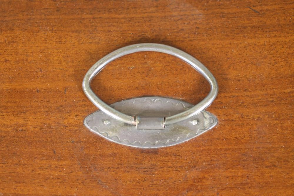 A LATE GEORGE III MAHOGANY TEA CADDY of plain oblong form with satinwood and ebony stringing Image