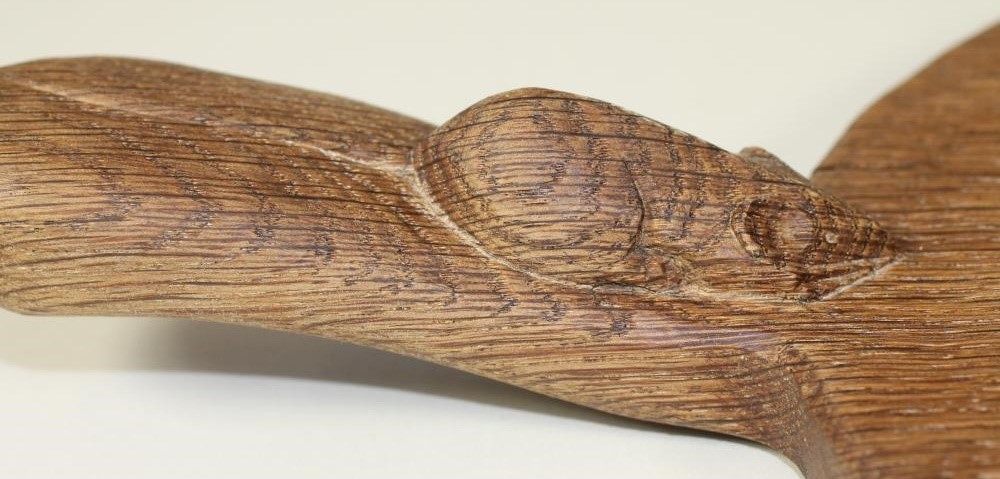 AN OAK CHEESE BOARD by Robert Thompson of plain oval form with carved mouse trademark to handle Image