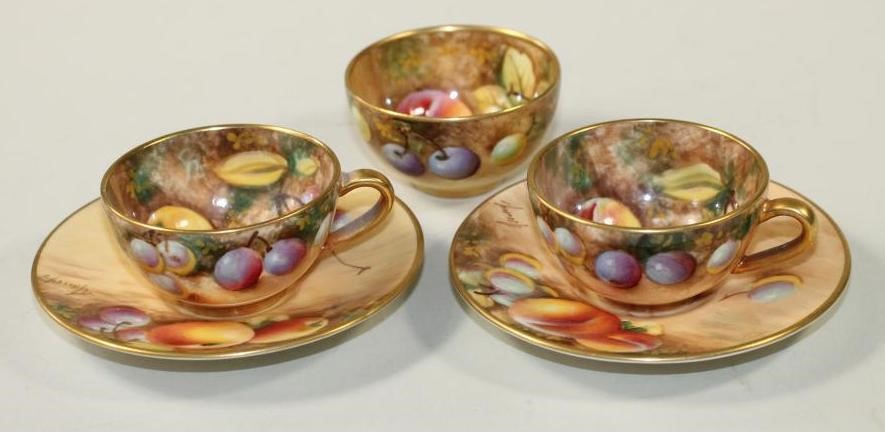 A PAIR OF ROYAL WORCESTER CHINA MINIATURE TEACUPS AND SAUCERS Image