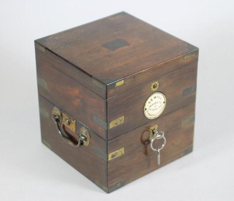 A LATE VICTORIAN BRASS BOUND MAHOGANY SHIP'S COMPASS CASE of typical cube form Image