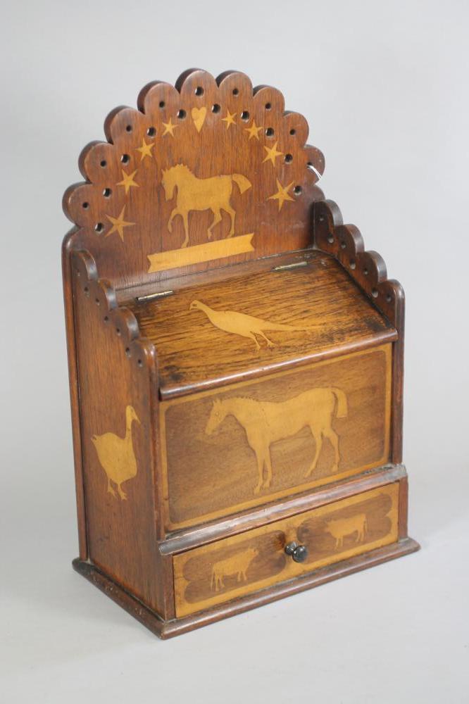 A VICTORIAN OAK CANDLE BOX of oblong form inlaid in fruitwood with birds and animals Image