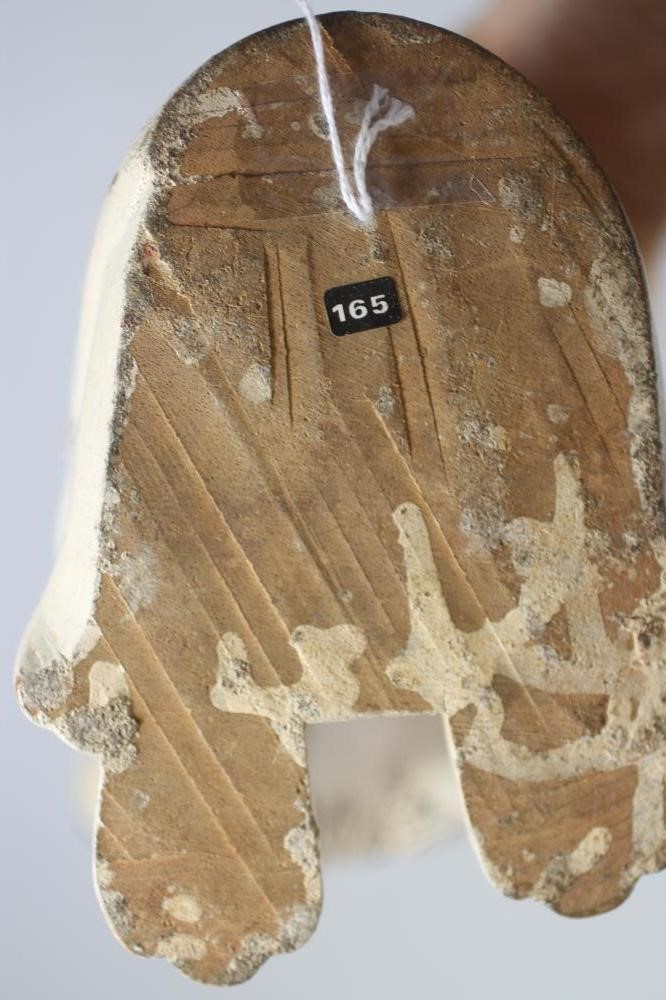 A VICTORIAN NAIVE SOFTWOOD CARVED AND PAINTED SPANIEL Image