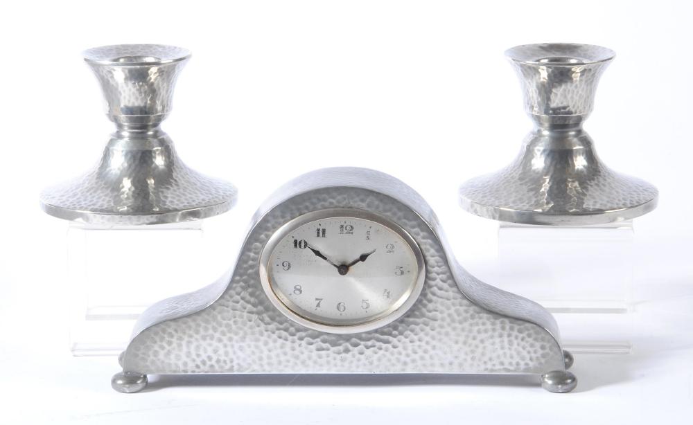 A TUDRIC PEWTER THREE PIECE MANTEL GARNITURE Image