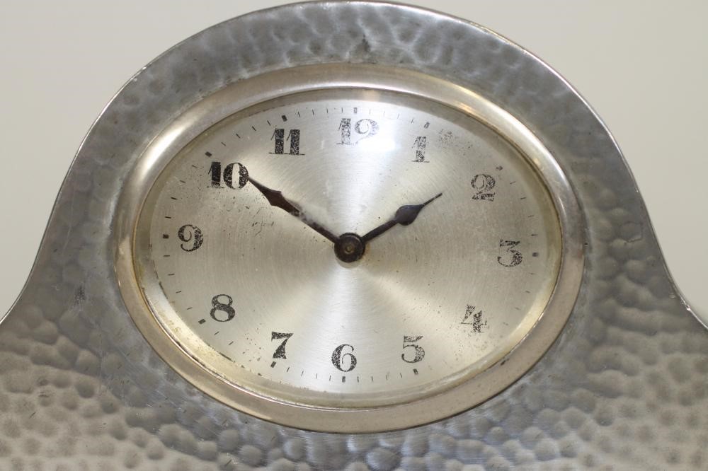 A TUDRIC PEWTER THREE PIECE MANTEL GARNITURE Image