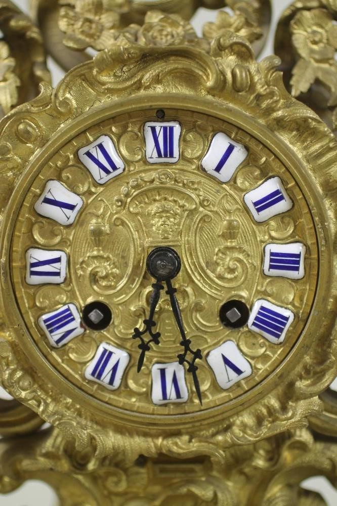 A FRENCH GILT METAL MANTEL CLOCK Image
