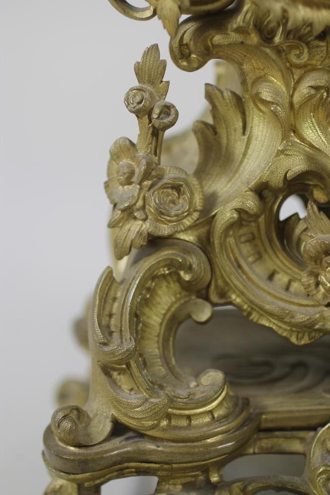 A FRENCH GILT METAL MANTEL CLOCK Image