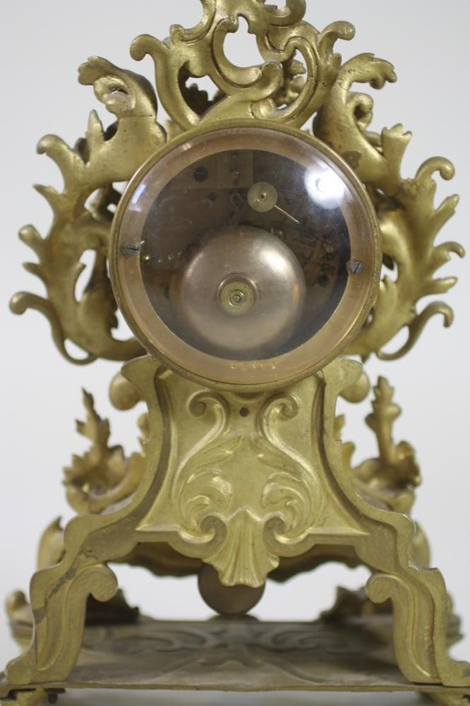 A FRENCH GILT METAL MANTEL CLOCK Image