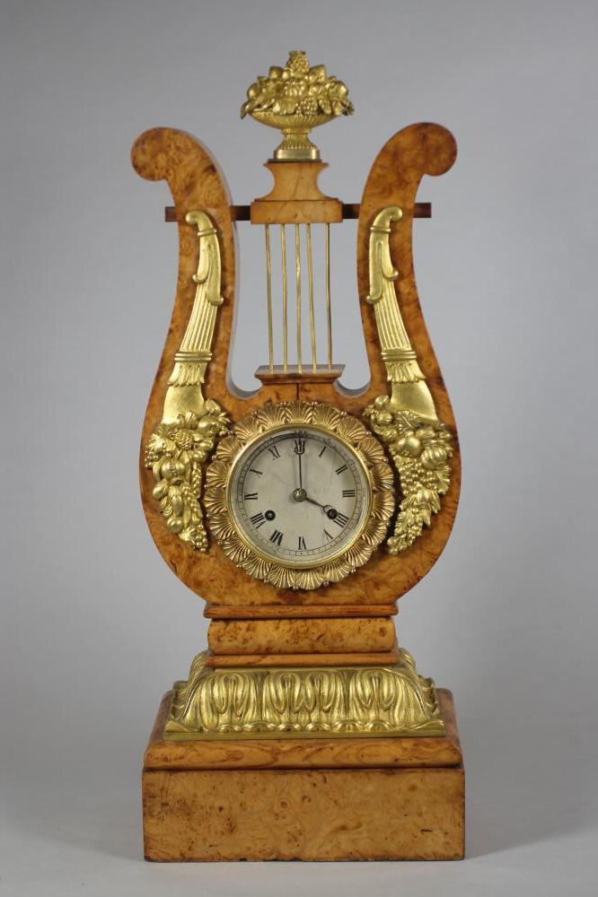 A FRENCH BURR MAPLE AND ORMOLU MANTEL CLOCK Image