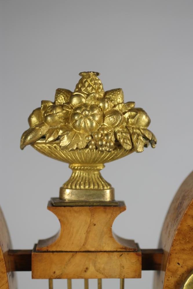 A FRENCH BURR MAPLE AND ORMOLU MANTEL CLOCK Image