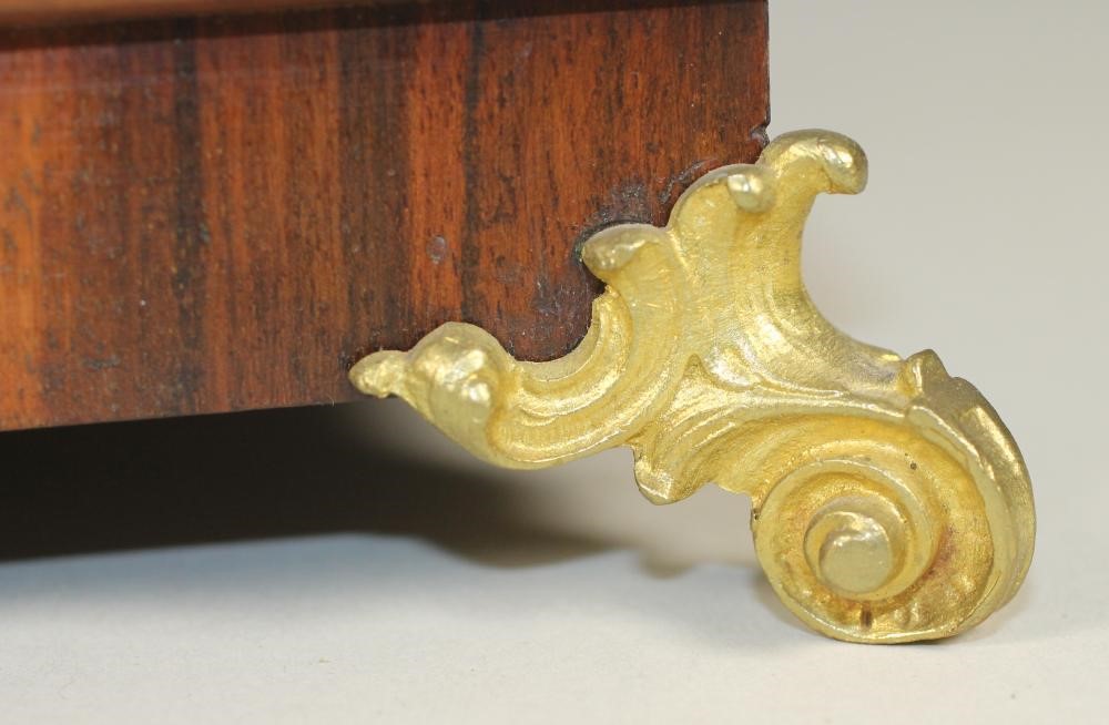 A MAHOGANY AND ORMOLU CASED MANTEL CLOCK Image
