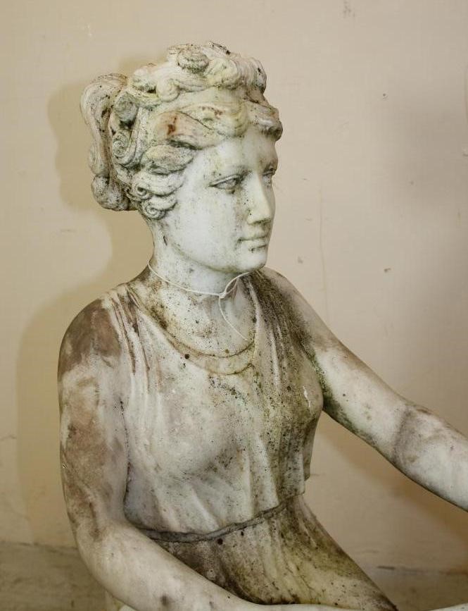A WHITE MARBLE FIGURE OF A SEATED CLASSICAL MAIDEN DRAWING Image