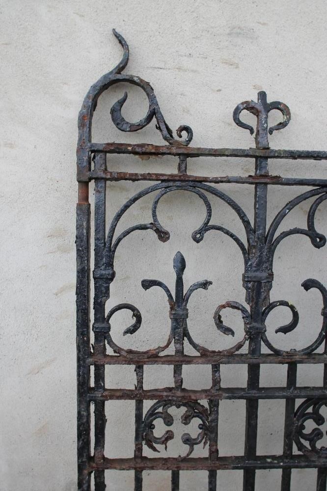 A PAIR OF WROUGHT AND CAST IRON ENTRANCE GATES Image
