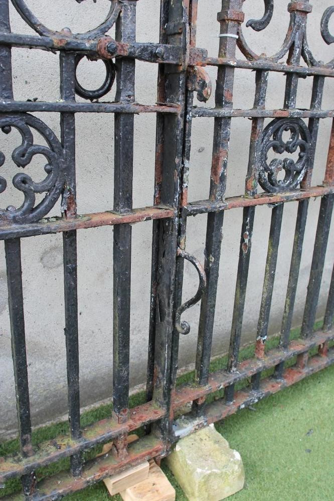 A PAIR OF WROUGHT AND CAST IRON ENTRANCE GATES Image