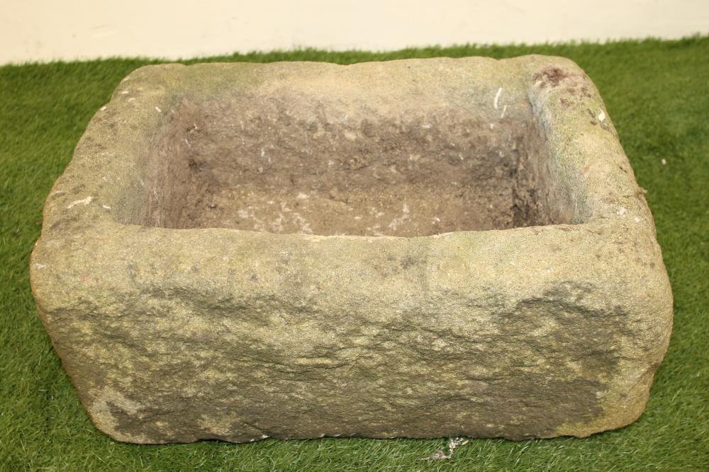 A SMALL SANDSTONE TROUGH of rough hewn regular oblong form Image
