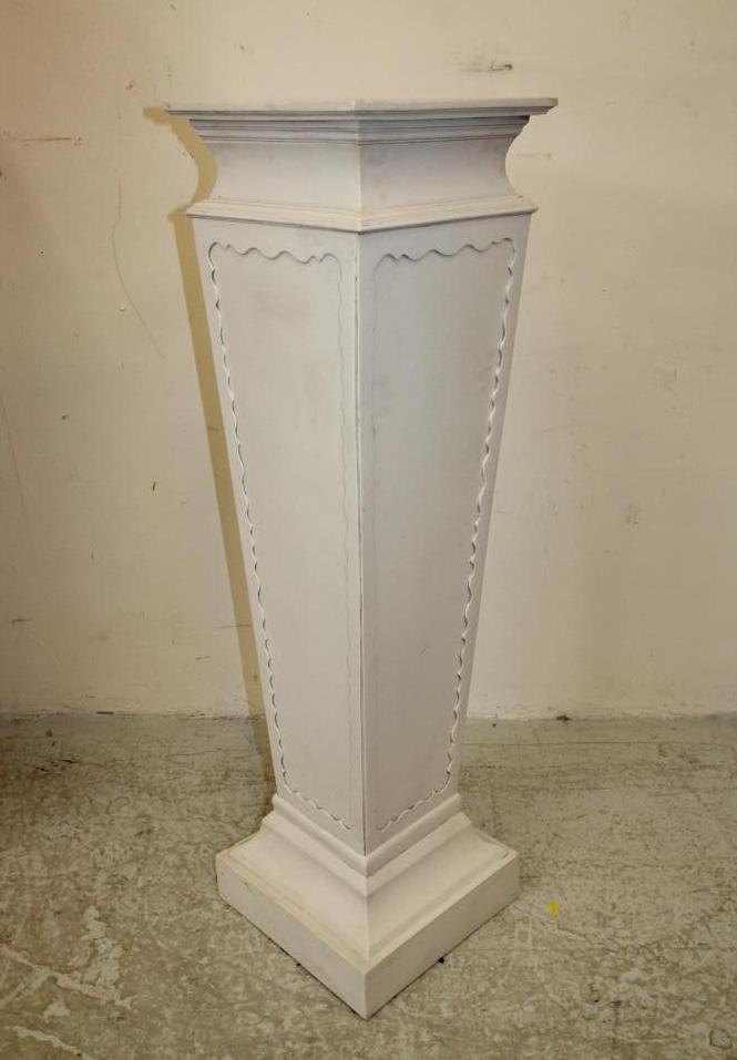 A COMPOSITION WHITE MARBLE PEDESTAL of square tapering form with wave edged panel to each side Image
