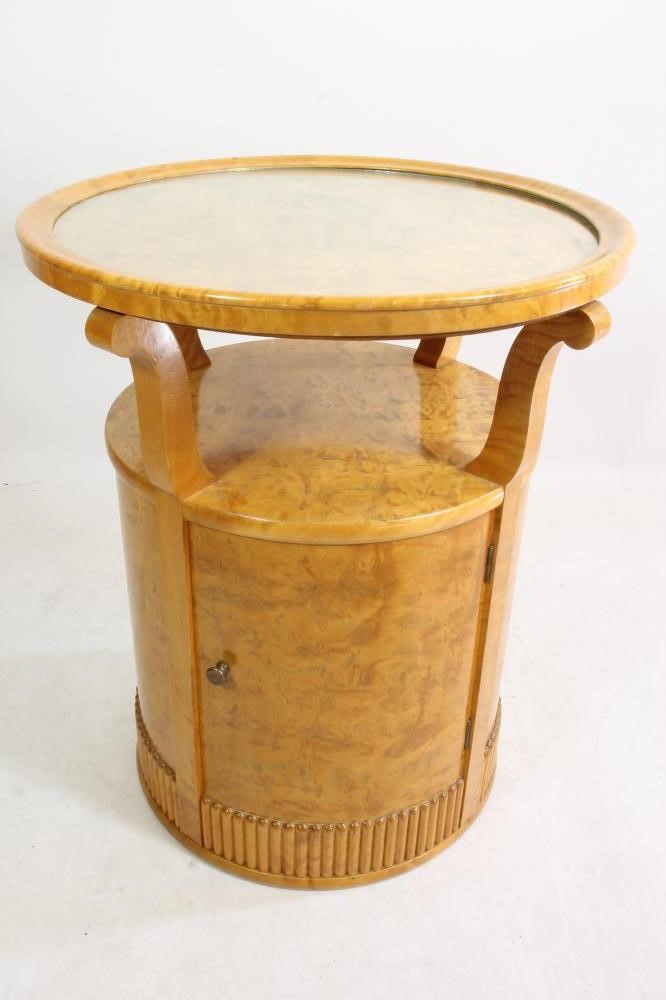 AN ART DECO MAPLE OCCASIONAL TABLE of circular form Image