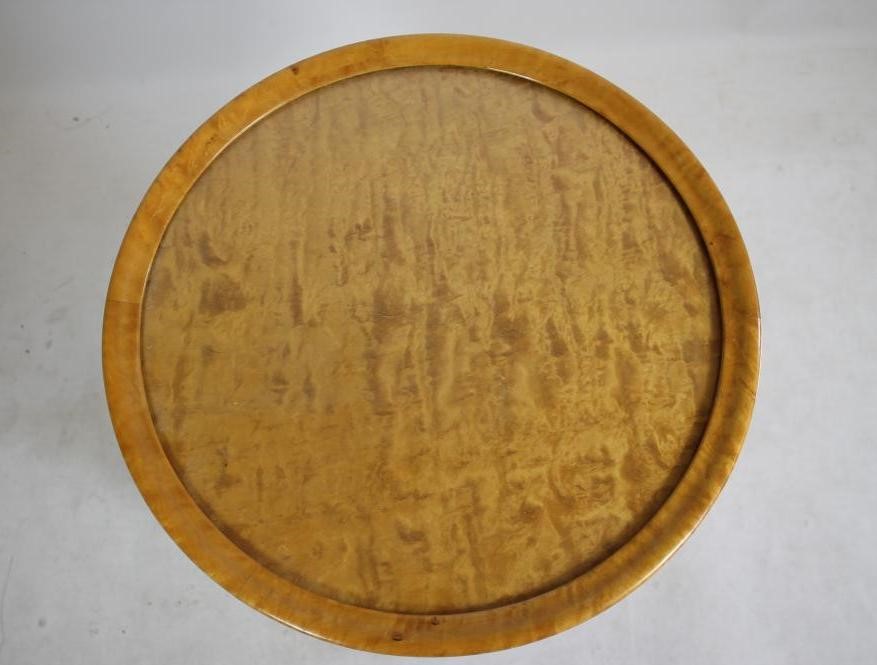 AN ART DECO MAPLE OCCASIONAL TABLE of circular form Image