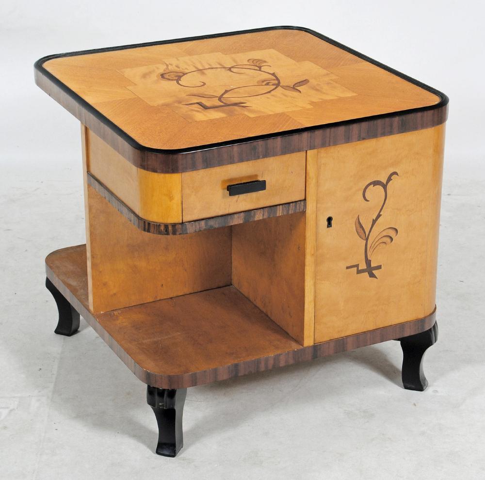 AN ART DECO MAPLE AND BEECH OCCASIONAL TABLE of low two tier rounded square form with ebony and Image
