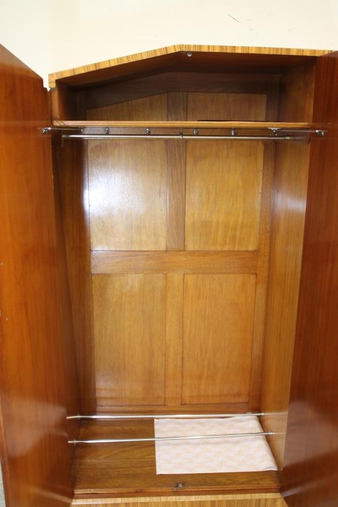 AN ART DECO BURR MAPLE VENEERED TRIPLE WARDROBE of arched stepped tapering form with zebra wood Image