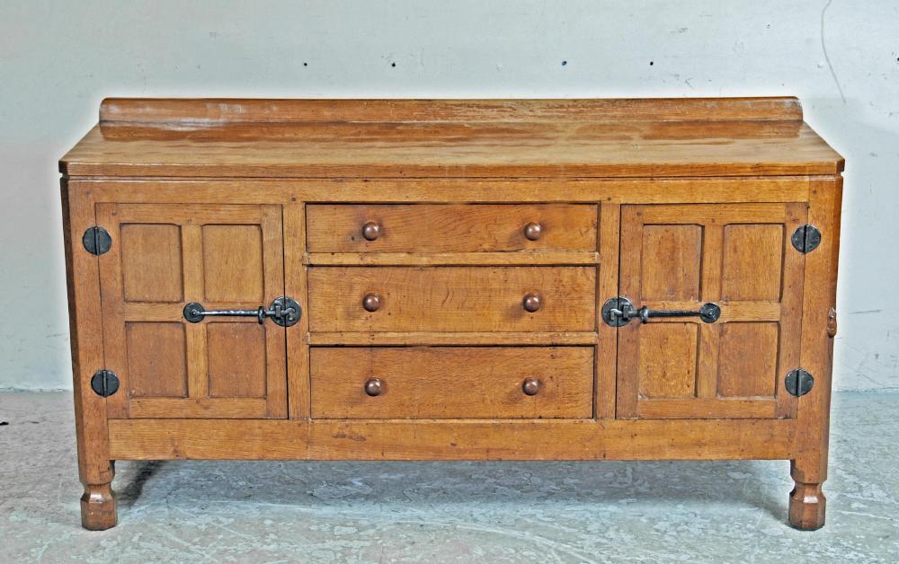 AN ADZED OAK SIDEBOARD by Robert Thompson Image