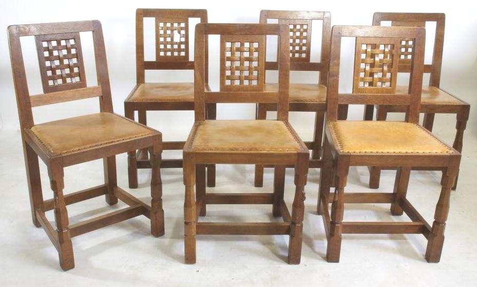 A SET OF SIX OAK DINING CHAIRS by Robert Thompson Image