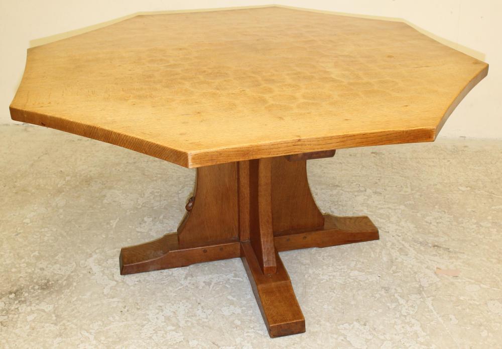 AN ADZED OAK DINING TABLE by Robert Thompson Image