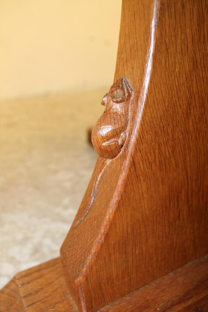 AN ADZED OAK DINING TABLE by Robert Thompson Image