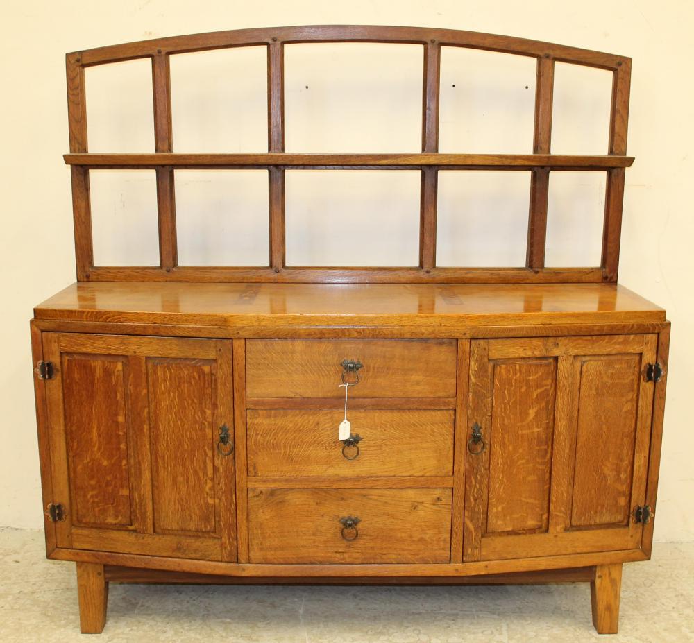 AN ARTS AND CRAFTS STYLE OAK SIDEBOARD Image