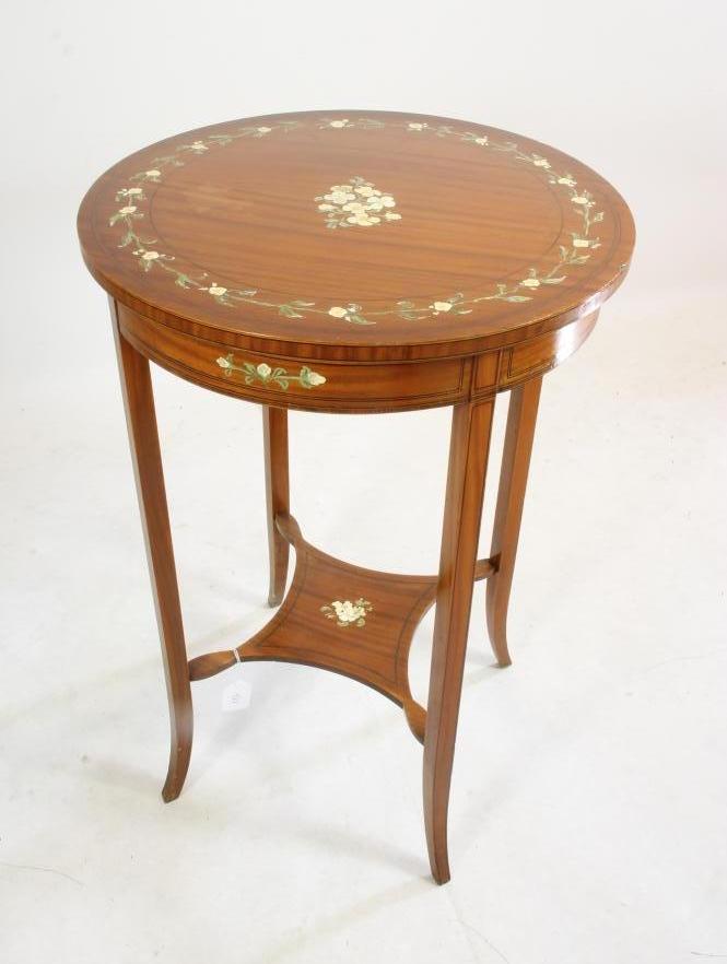 AN EDWARDIAN PAINTED SATINWOOD OCCASIONAL TABLE of circular form crossbanded with stringing Image
