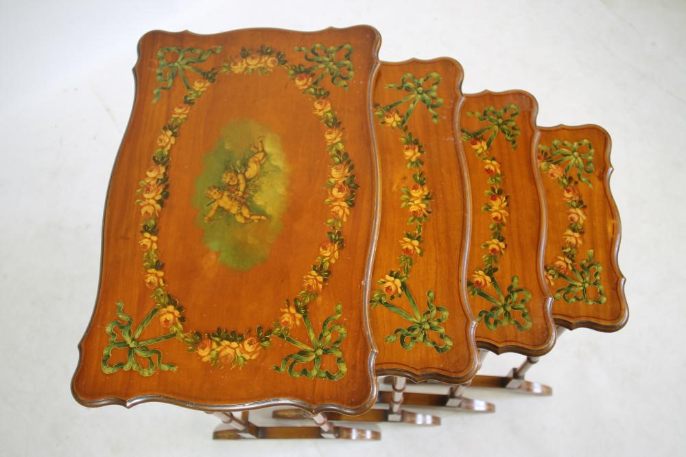 AN EDWARDIAN SATINWOOD AND POLYCHROME PAINTED QUARTETTO NEST OF TABLES of serpentine oblong form Image